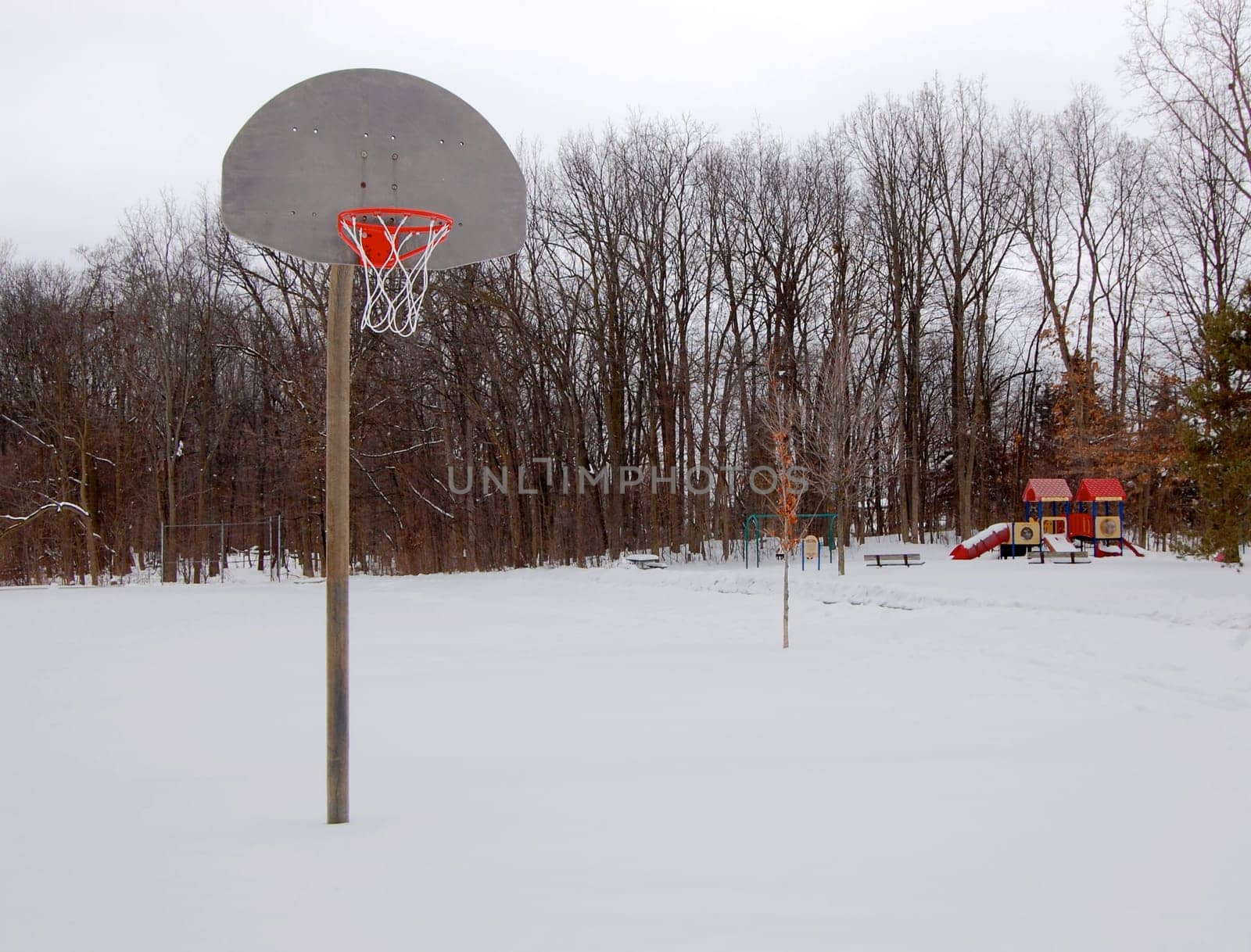 basketball hoop and playground in the snow