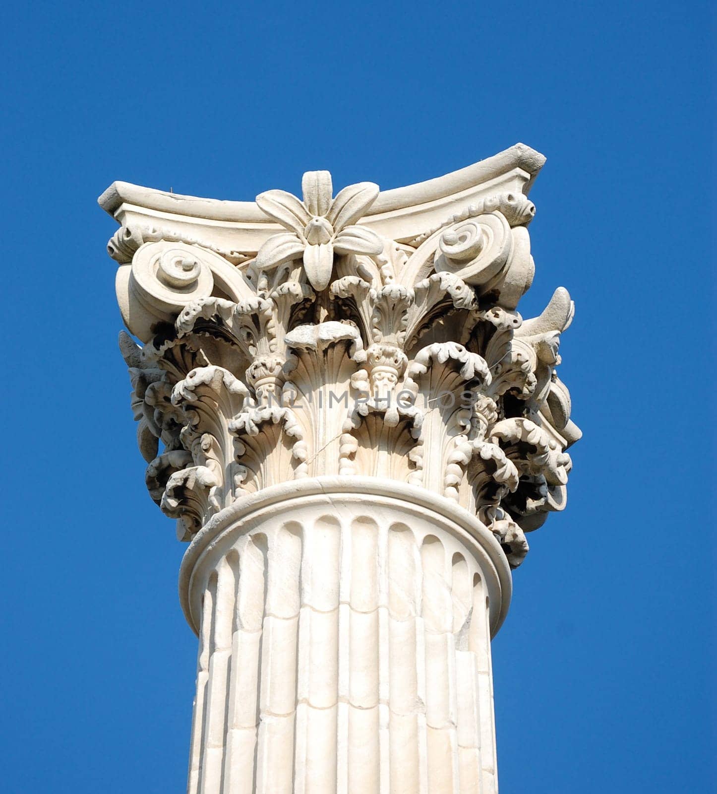 corinthian column against blue sky