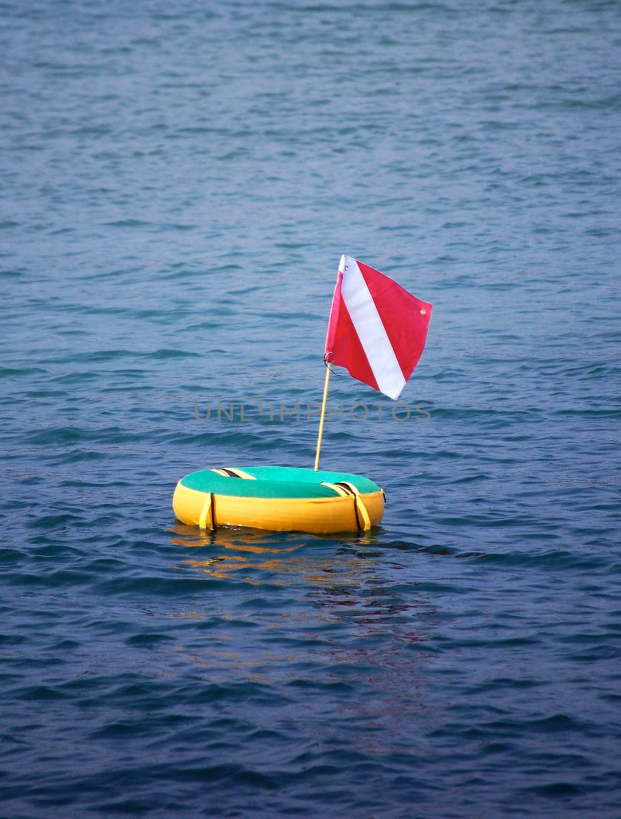 scuba flag on floater in bay