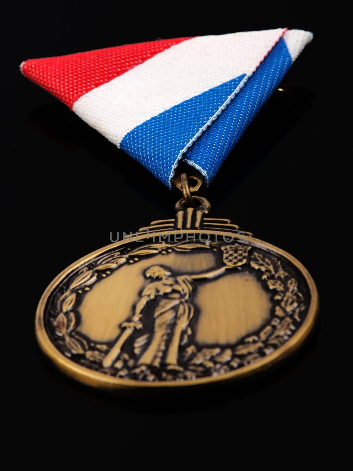 bronze medal for war heroes  isolated on black background