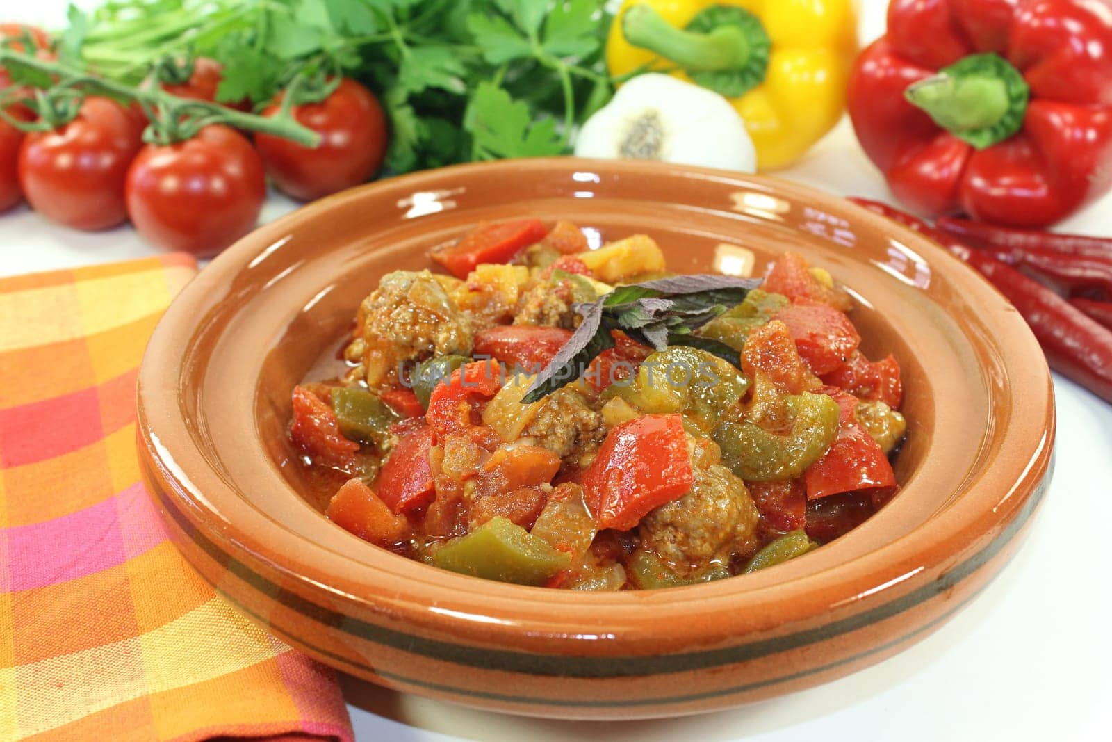 an oriental vegetable stir-fry with bell pepper tomato and meatballs