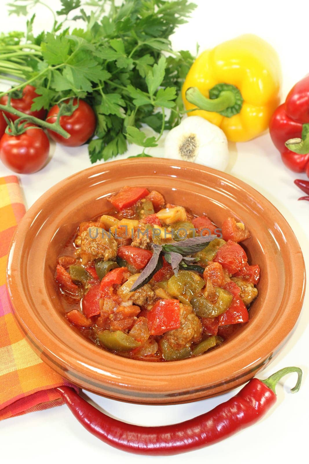 an oriental vegetable stir-fry with bell pepper tomato and meatballs