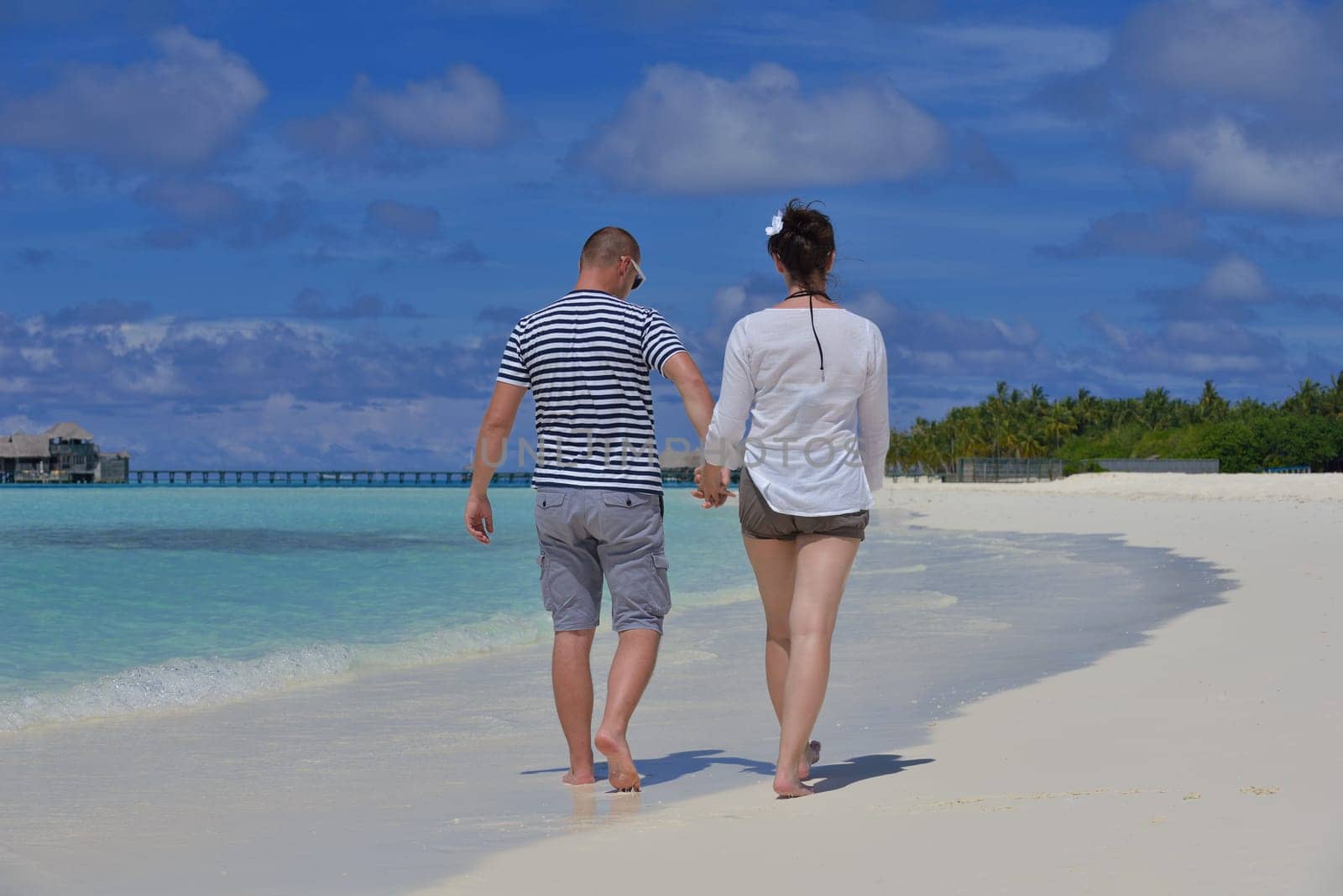 happy young couple relax and take fresh drink at summer vacation