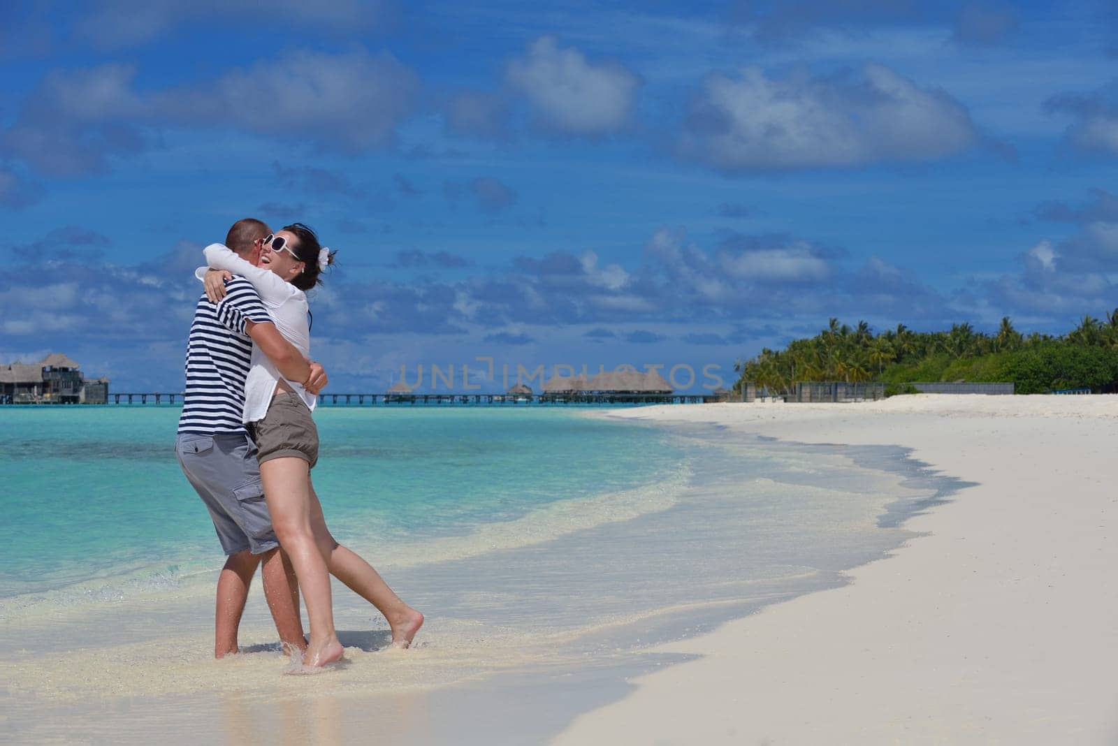 happy young couple relax and take fresh drink at summer vacation