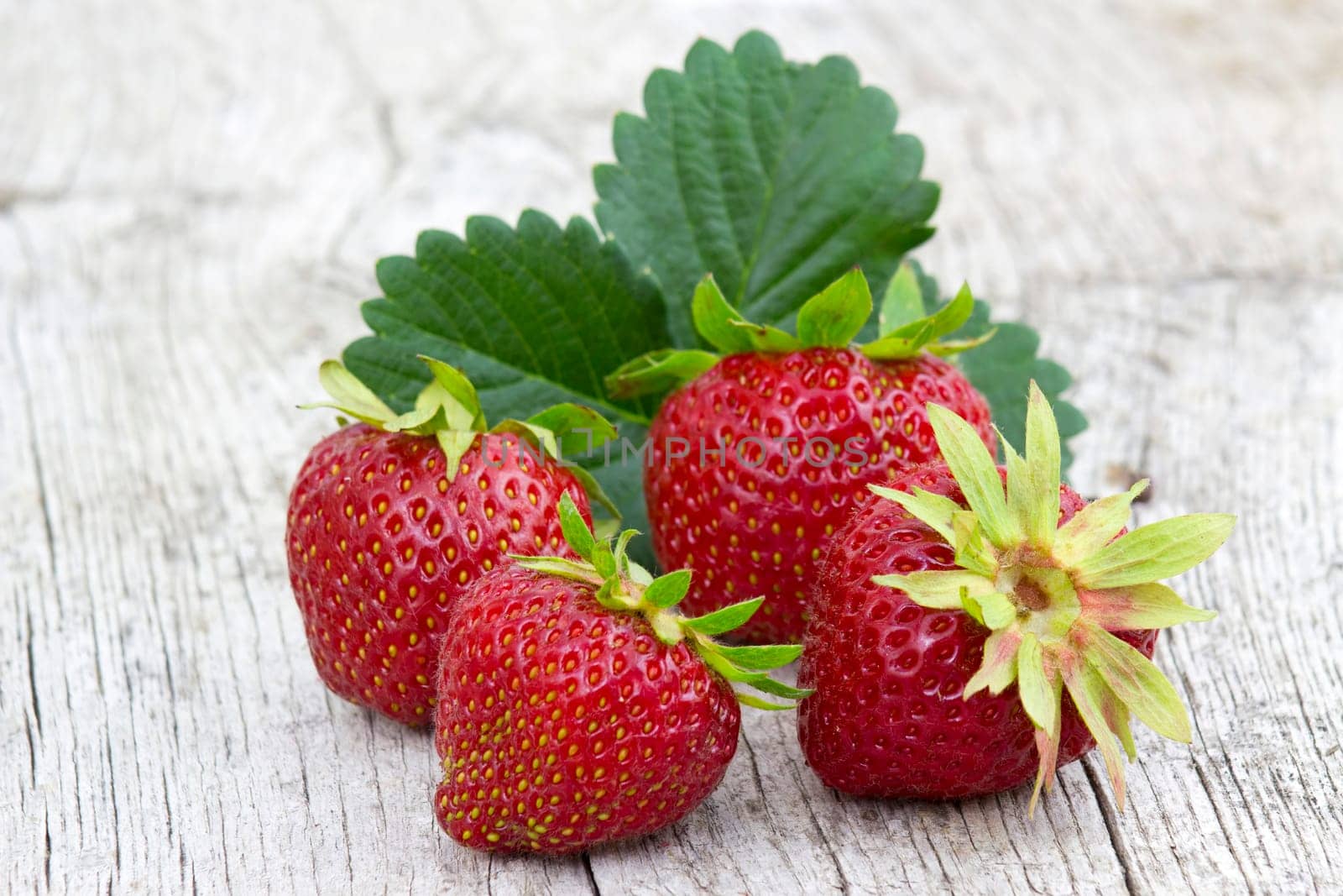 fresh strawberries on wooden background