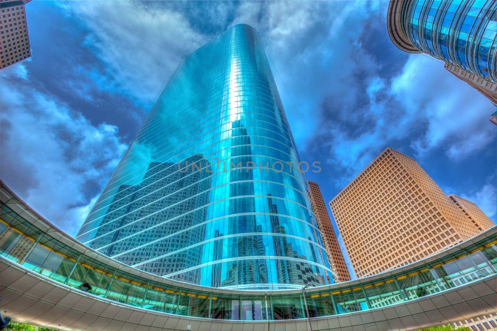 Houston downtown skyscrapers disctict with mirror blue sky reflection
