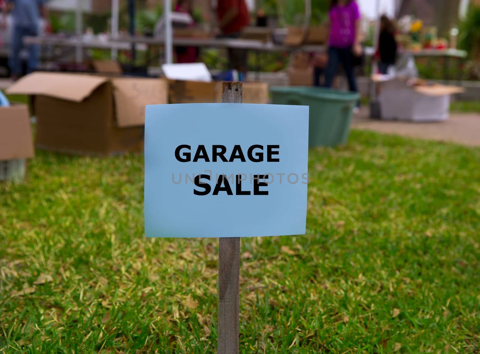 Garage sale in an american weekend on the yard green lawn