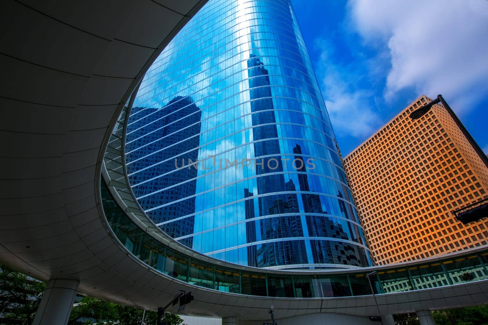 Houston downtown skyscrapers disctict with mirror blue sky reflection