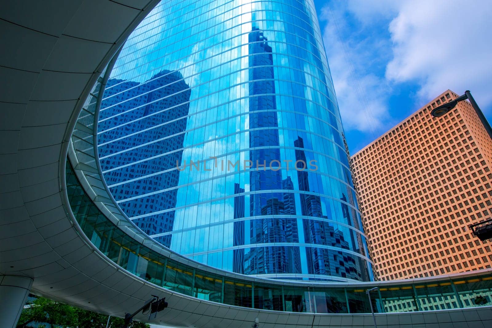 Houston downtown skyscrapers disctict with mirror blue sky reflection
