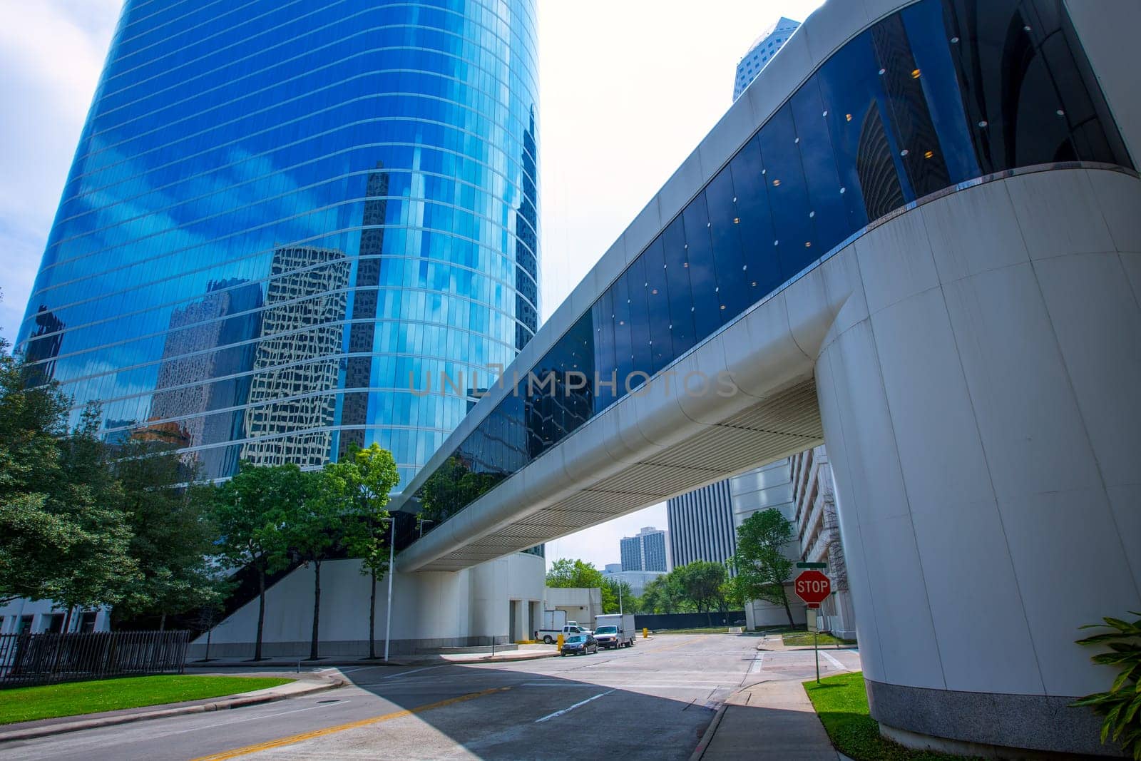 Houston downtown skyscrapers disctict with mirror blue sky reflection