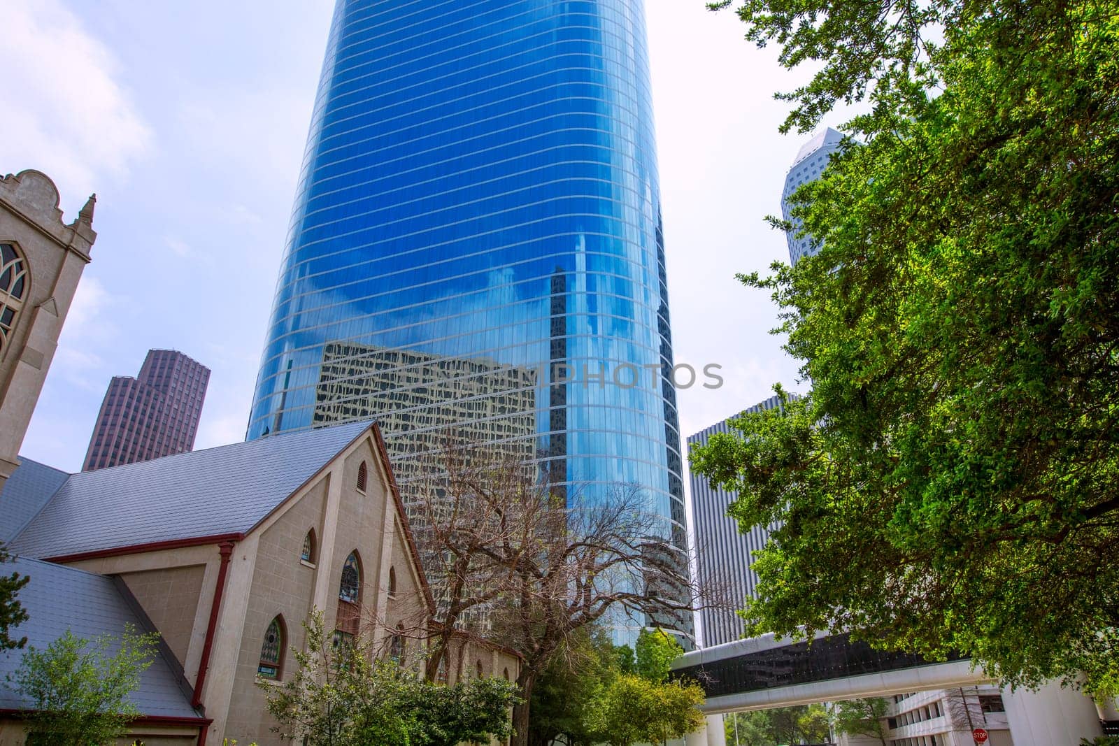Houston downtown skyscrapers disctict with mirror blue sky reflection