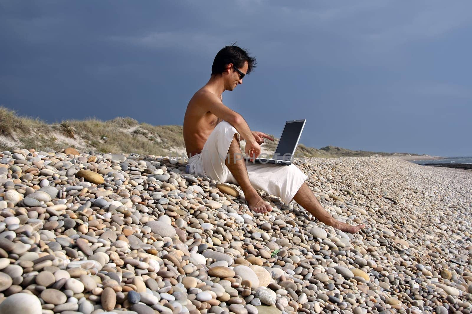 Surfer working on his laptop