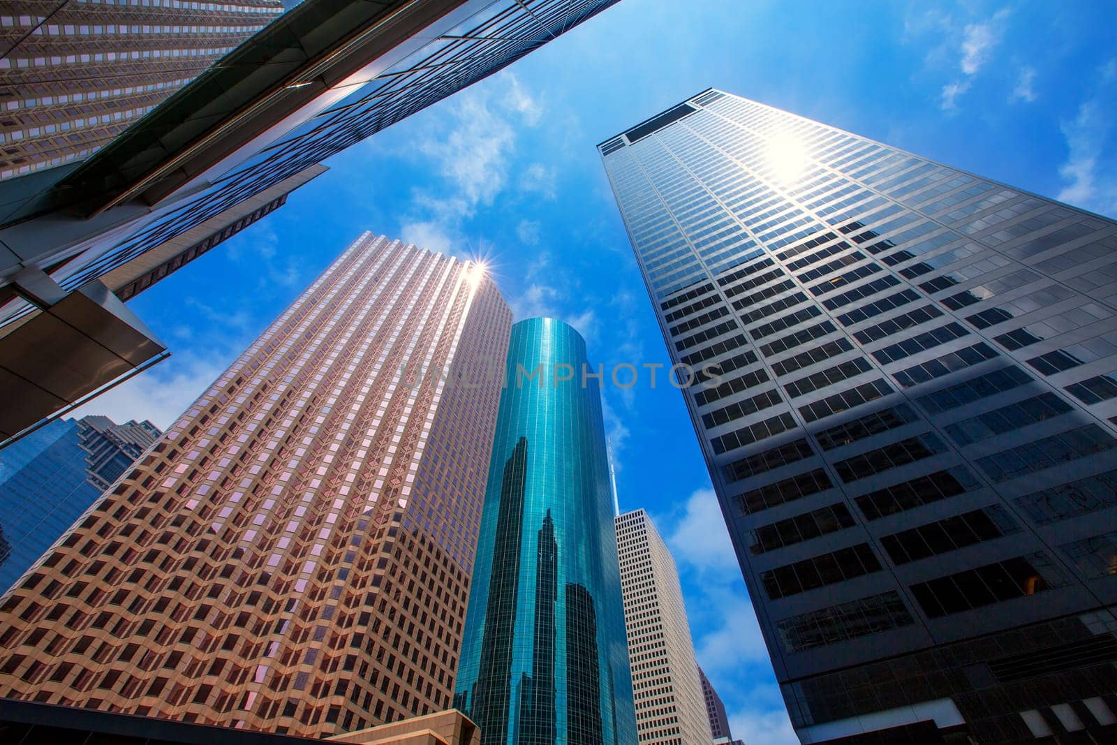 Houston downtown skyscrapers disctict with mirror blue sky reflection