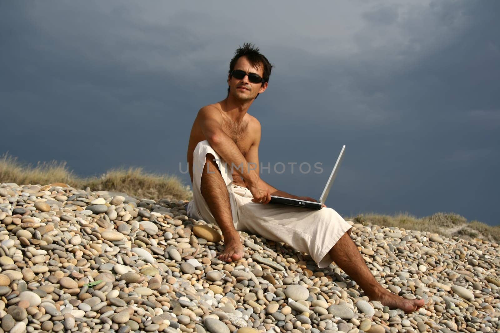 Surfer working on his laptop