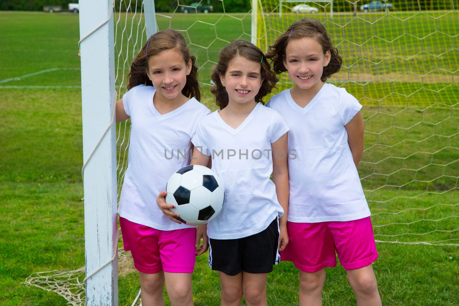 Soccer football kid girls team at sports outdoor fileld before match