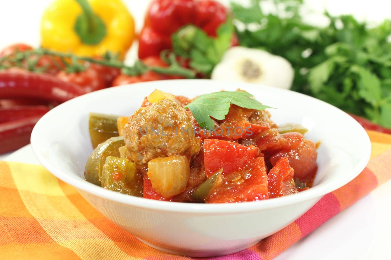 an oriental vegetable stir-fry with bell pepper tomato and meatballs