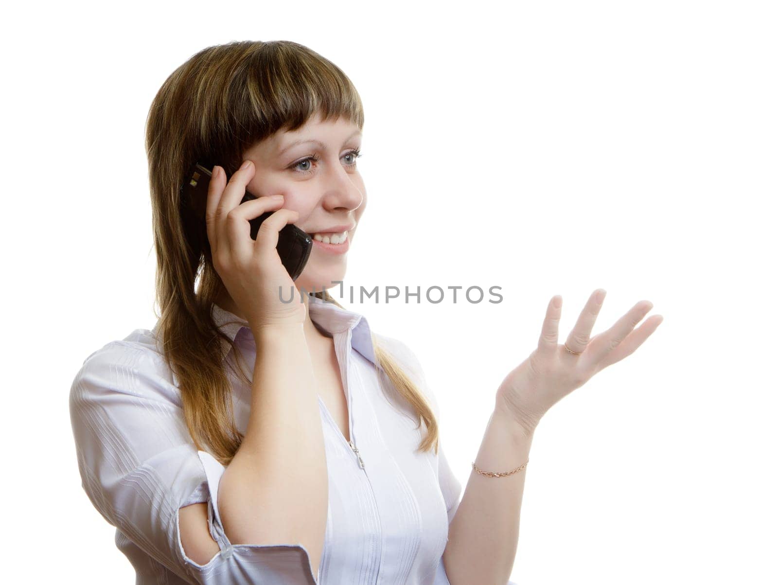 young woman talking on a cell phone on a white background