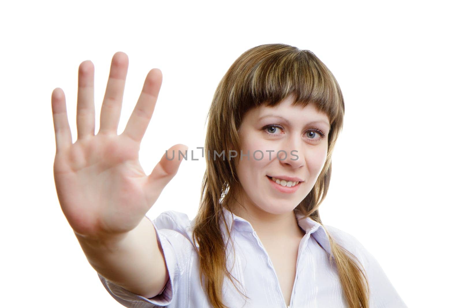 Young girl shows her hand on a white background
