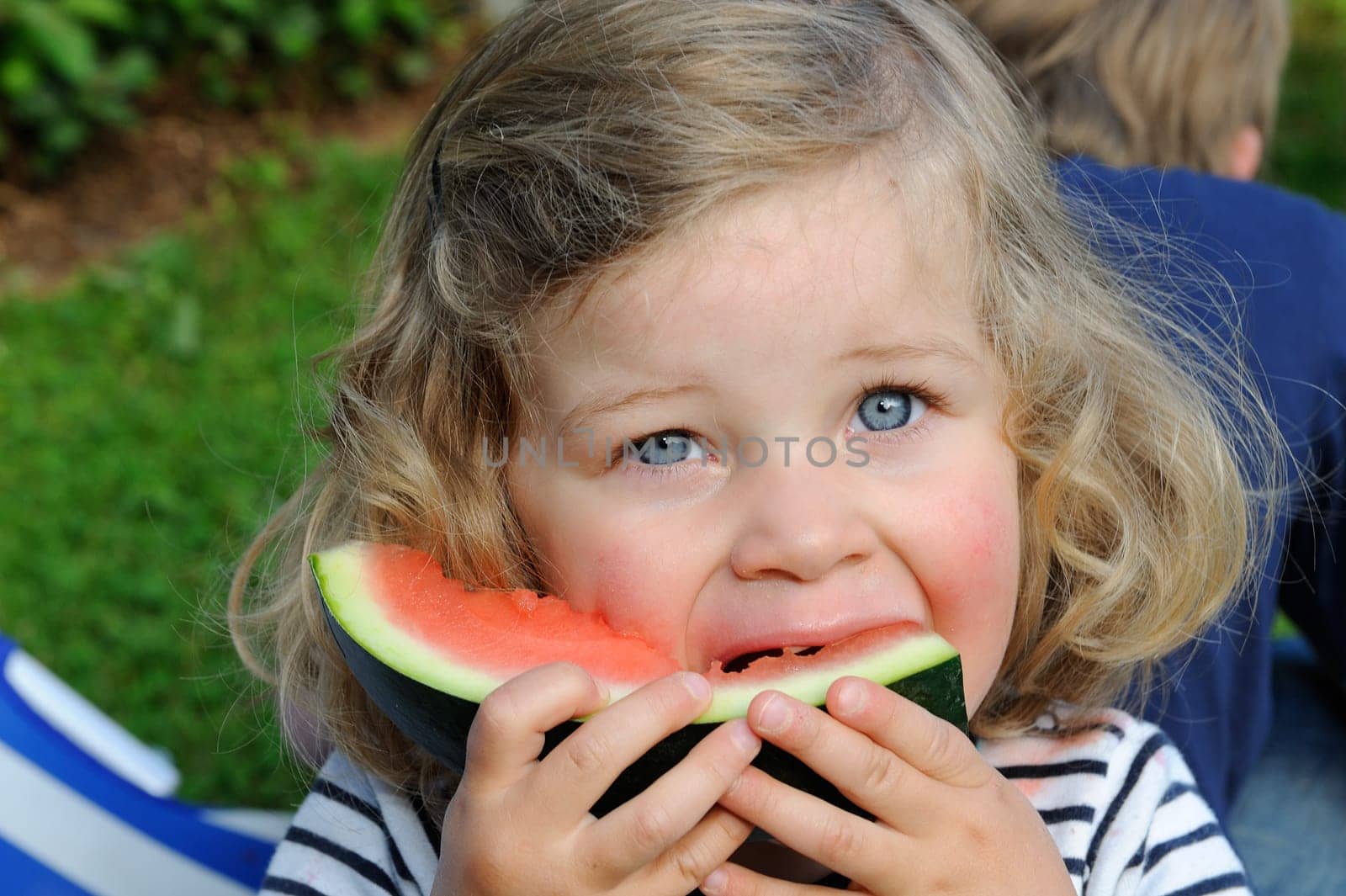 girl is eating water melon