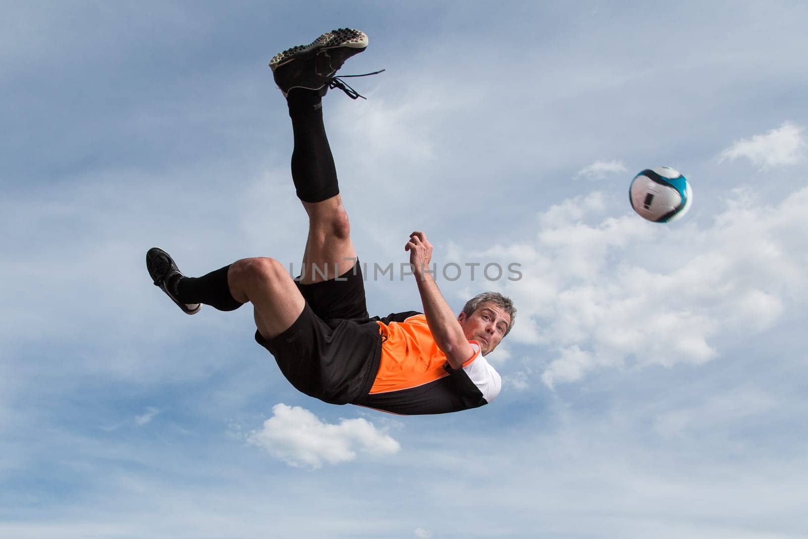 Footballers scoring goal