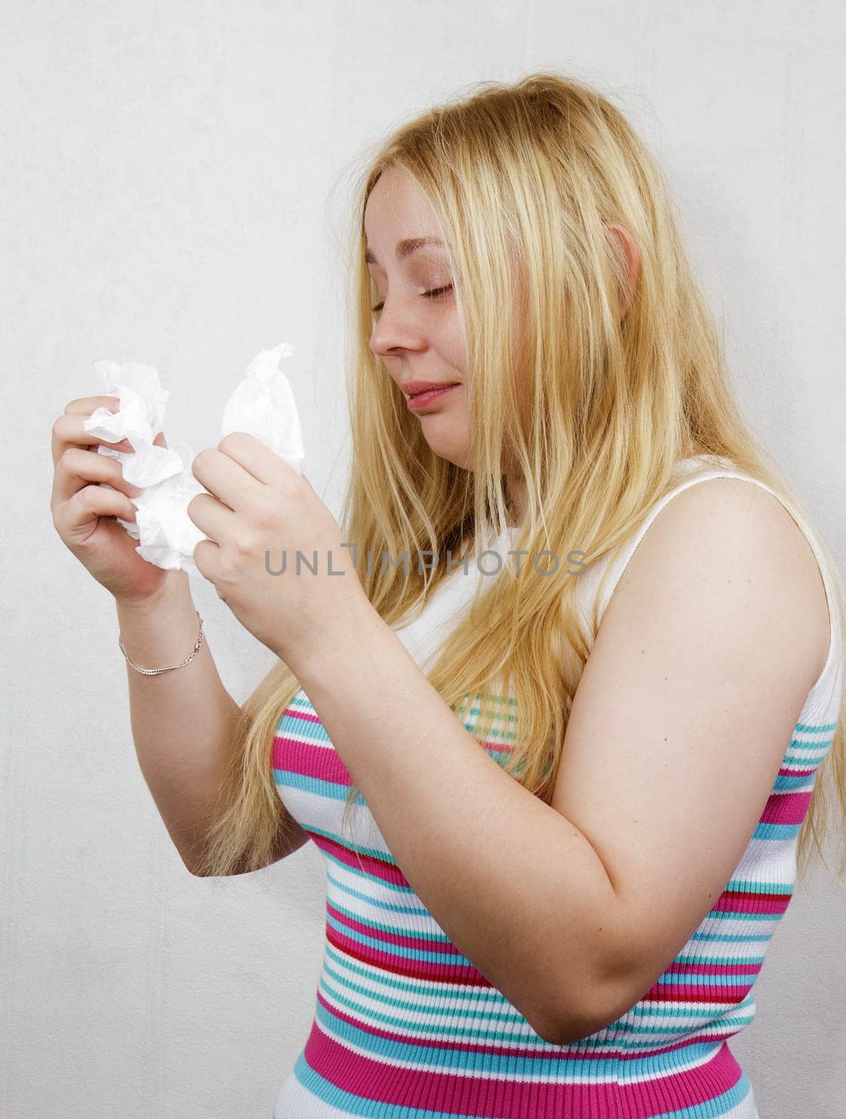 cold blonde girl with the handkerchief on a white background