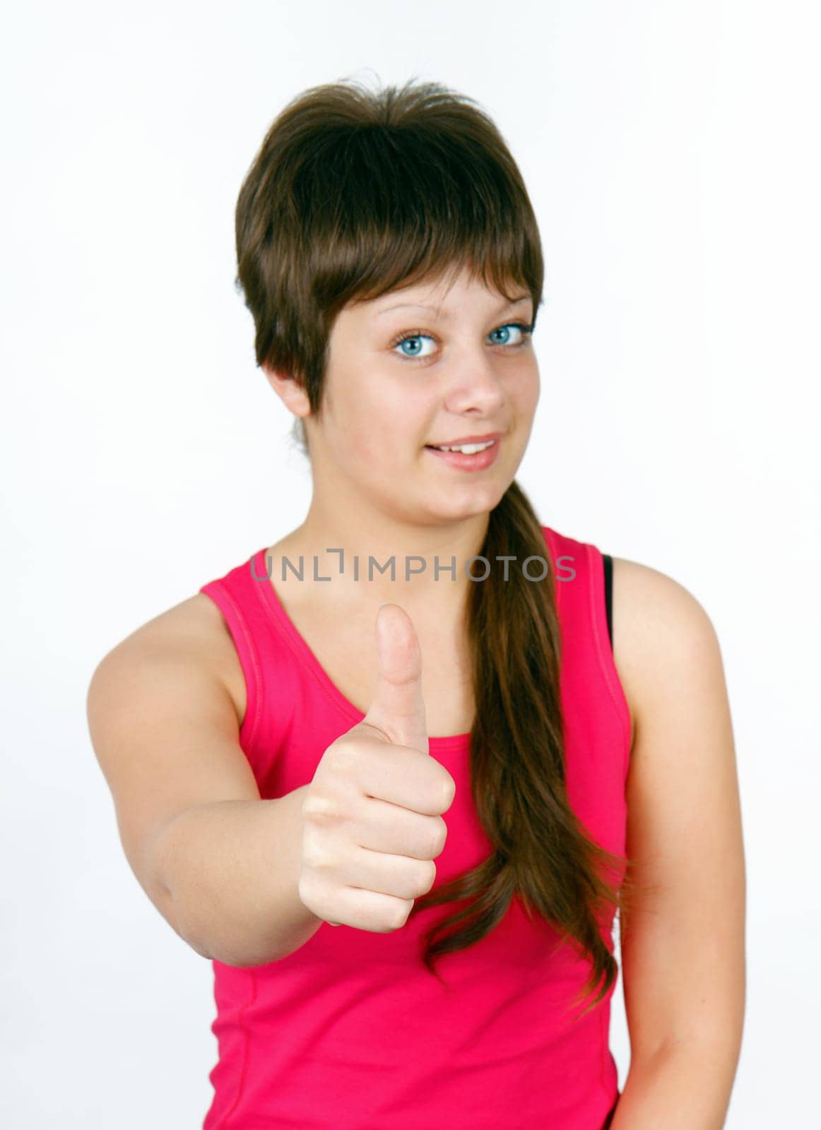 girl with thumb up on a light background