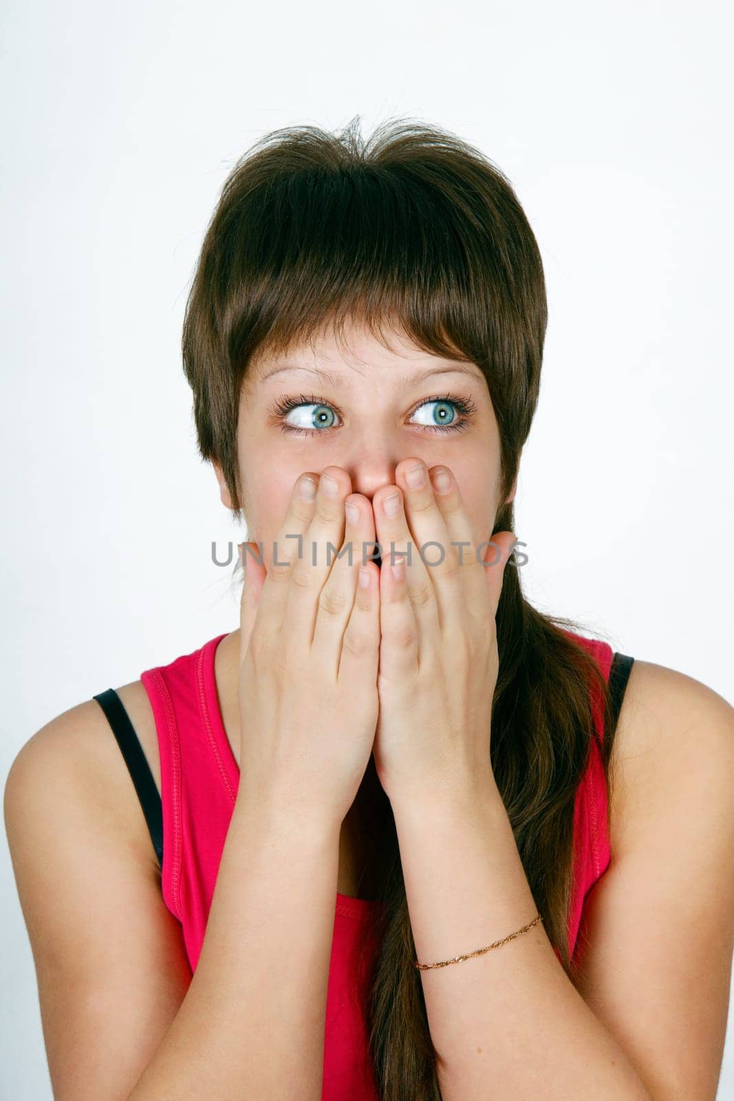 frightened she closes her mouth her ​​hands