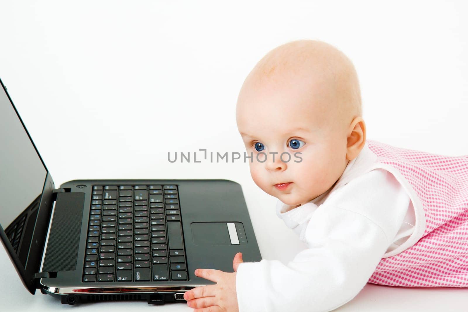little kid in the studio with a laptop