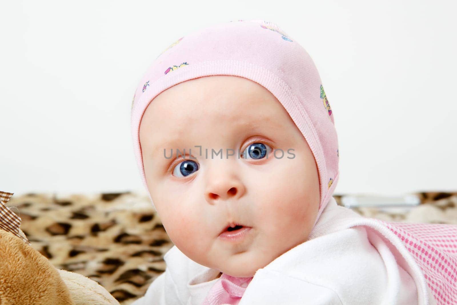 Portrait of a surprised little girl in the hat