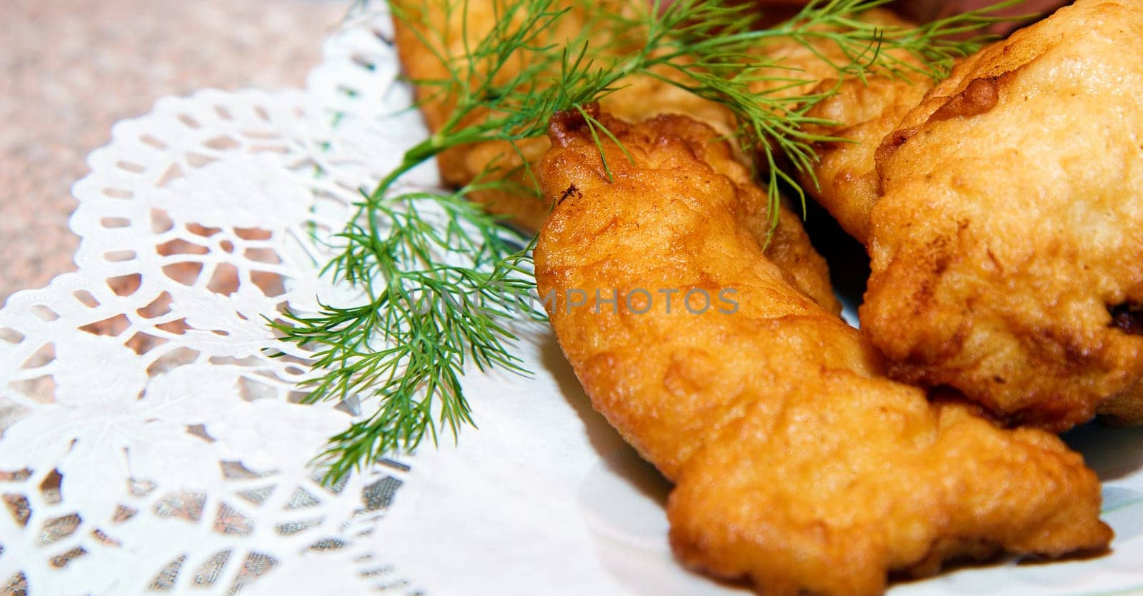 fish in batter on a plate. Festive table