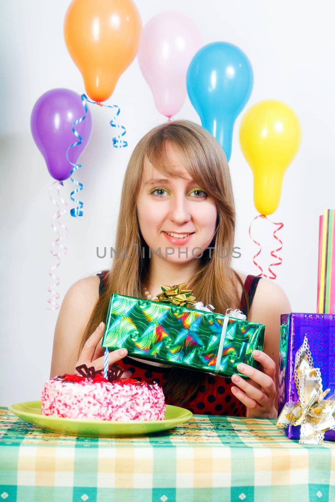 Birthday. Smiling girl with a gift in their hands