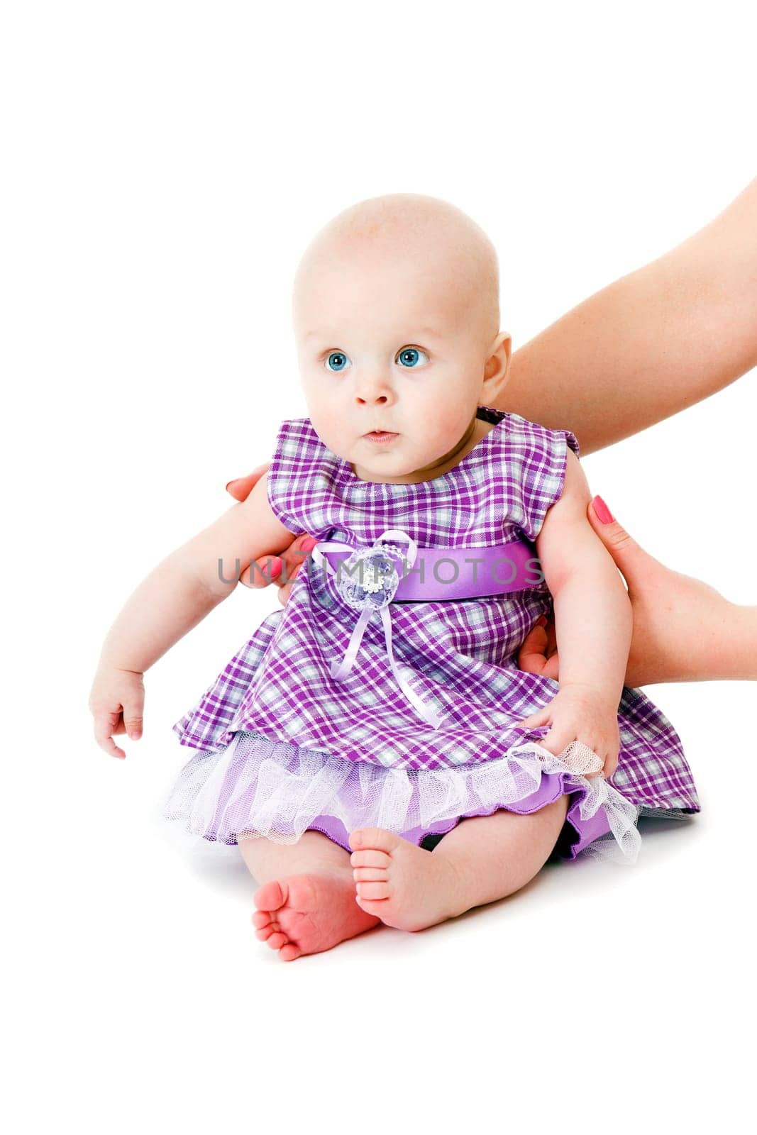 baby girl in a beautiful dress on a white background
