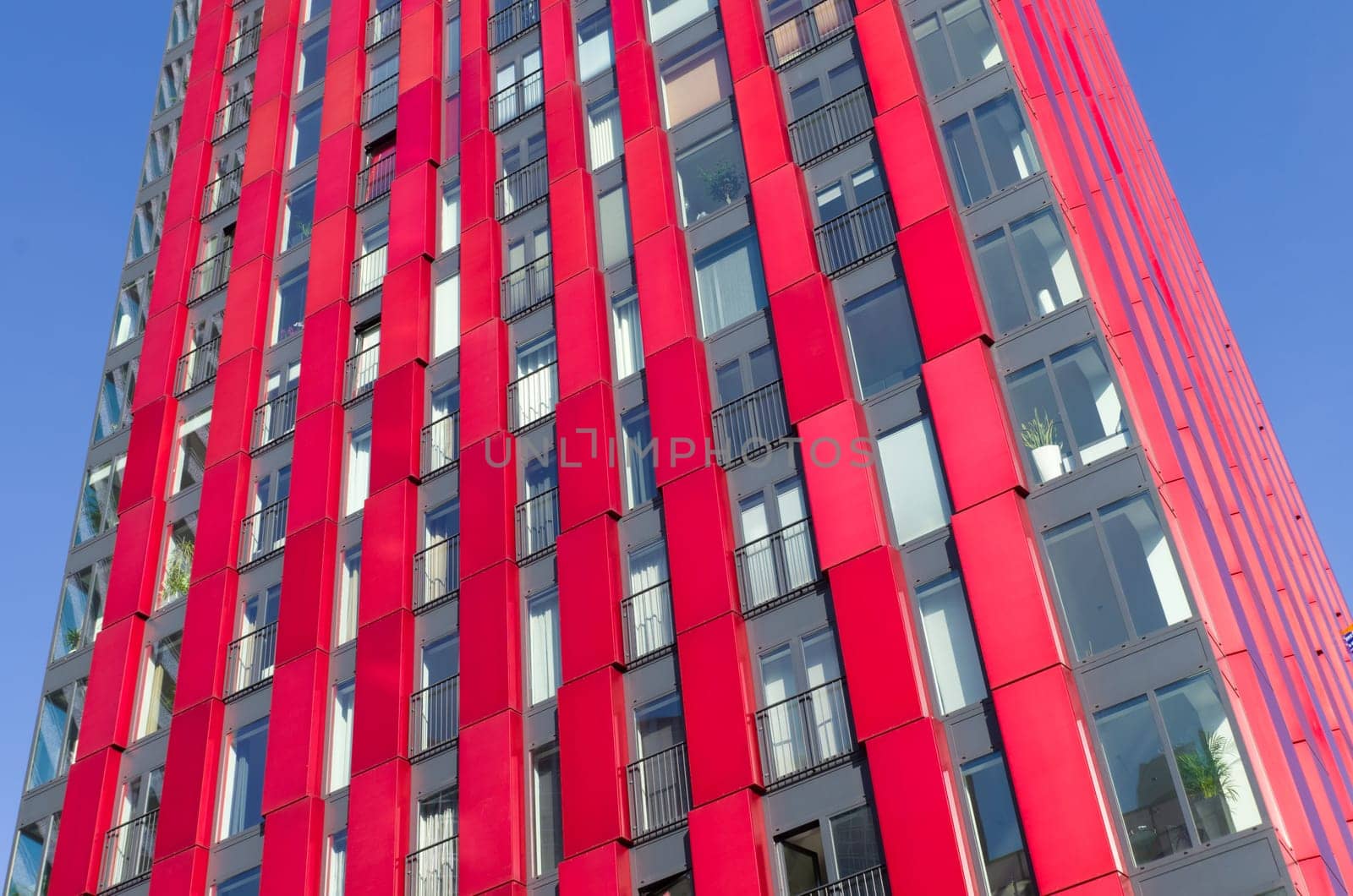 exterior of the 'red apple', a modern residential tower in Rotterdam. Designed by KCAP architects (exterior) and Jan des Bouvrie (interior), the 120 tall building counts 39 floors.