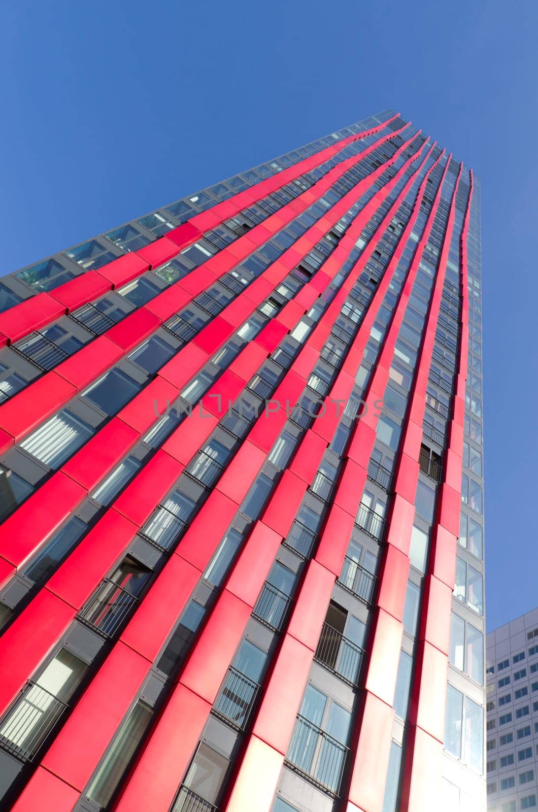 exterior of the 'red apple', a modern residential tower in Rotterdam. Designed by KCAP architects (exterior) and Jan des Bouvrie (interior), the 120 tall building counts 39 floors.