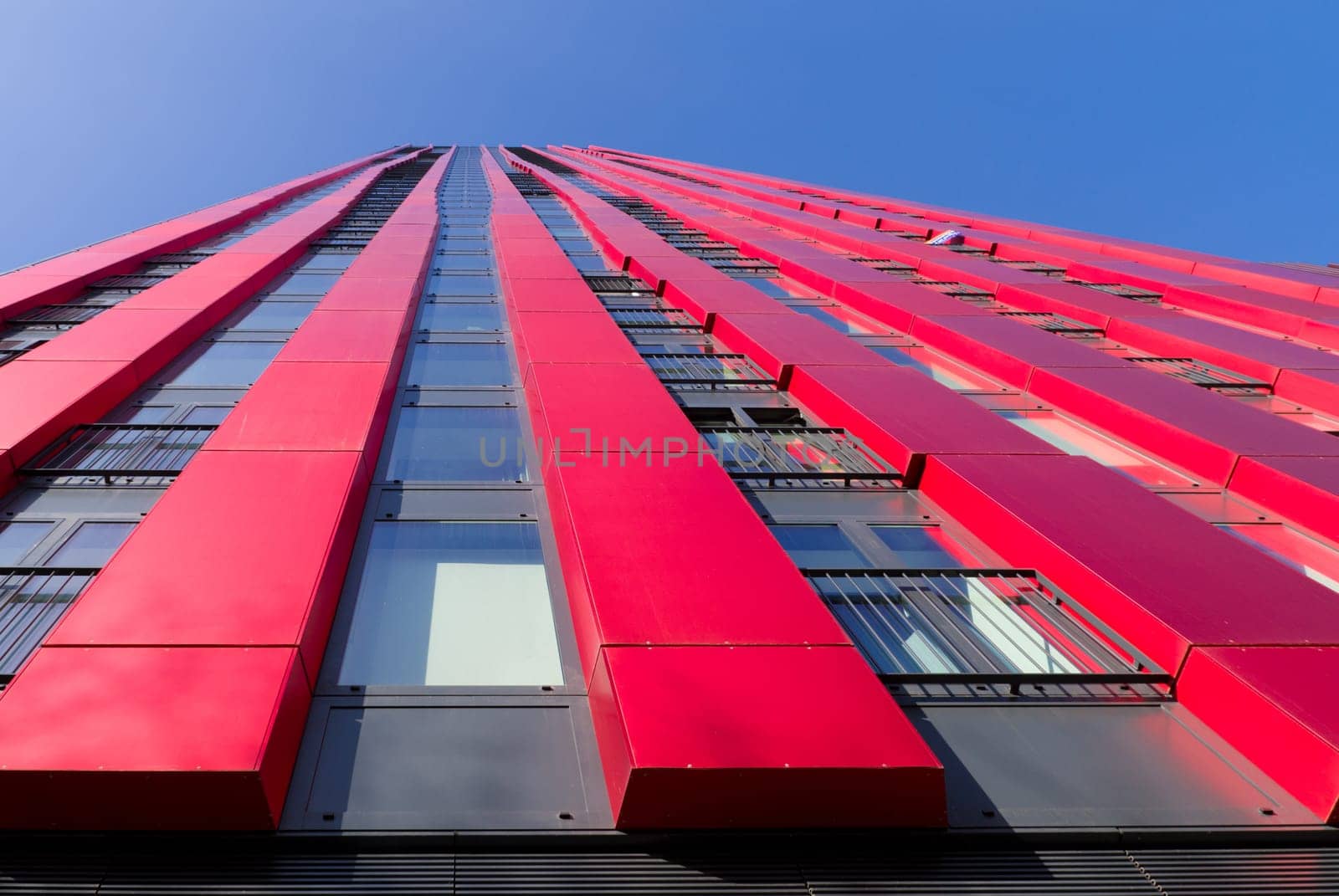 exterior of the 'red apple', a modern residential tower in Rotterdam. Designed by KCAP architects (exterior) and Jan des Bouvrie (interior), the 120 tall building counts 39 floors.