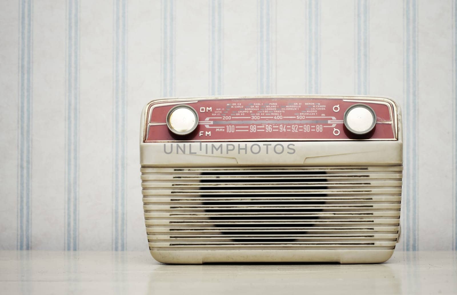 Antique radio on vintage wallpaper