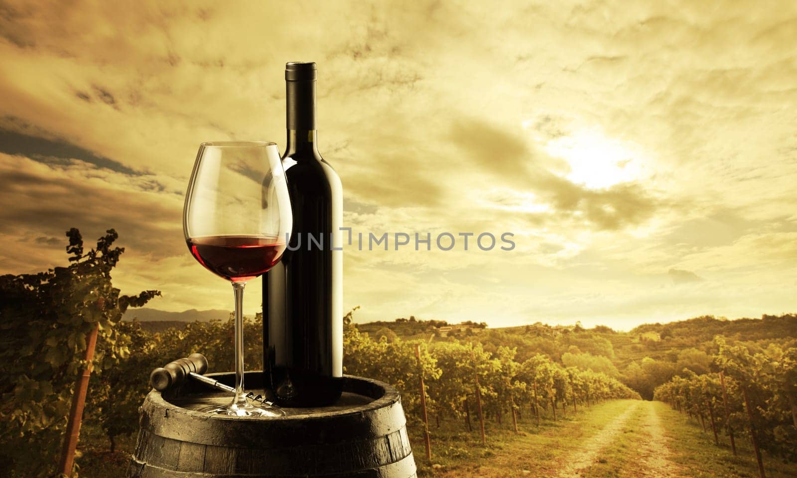 red wine bottle and wine glass on wodden barrel