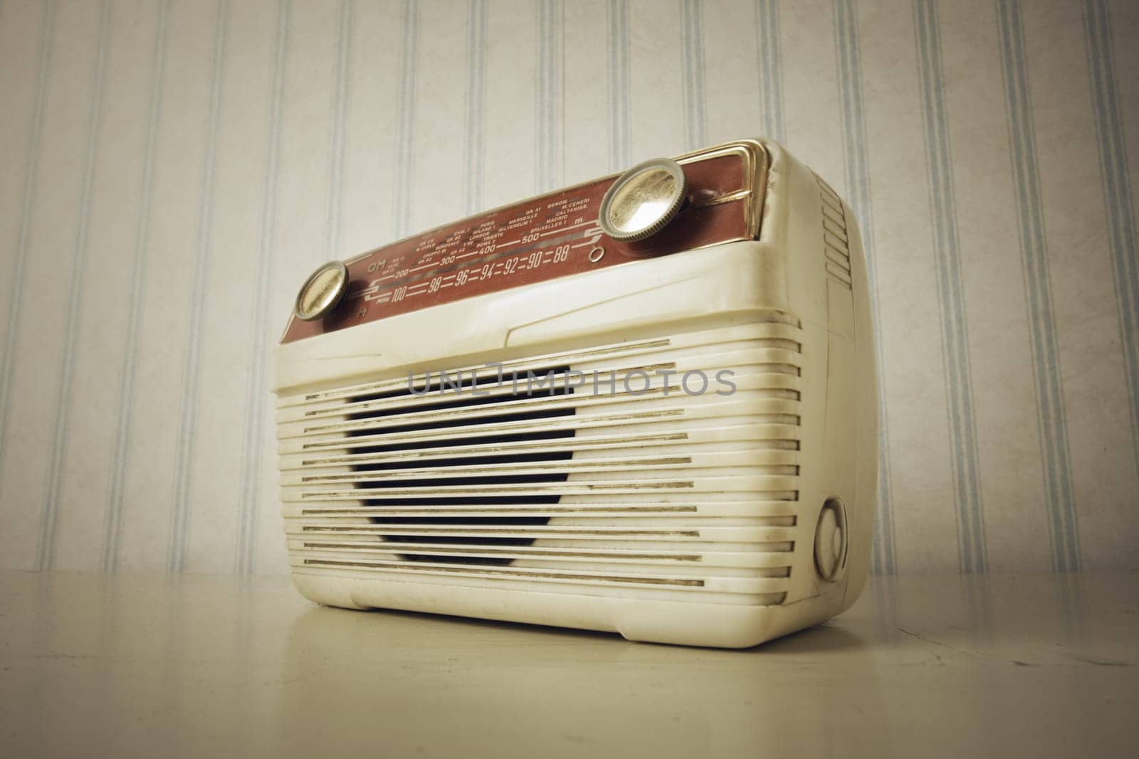 Antique radio on vintage wallpaper