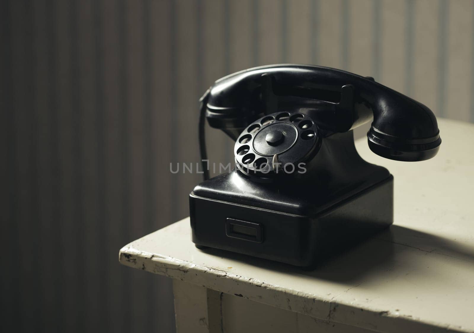 Old-fashioned phone on a wooden table
