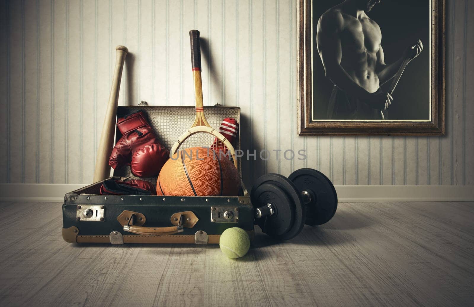 Old Suitcase with sports equipment and athlete photo