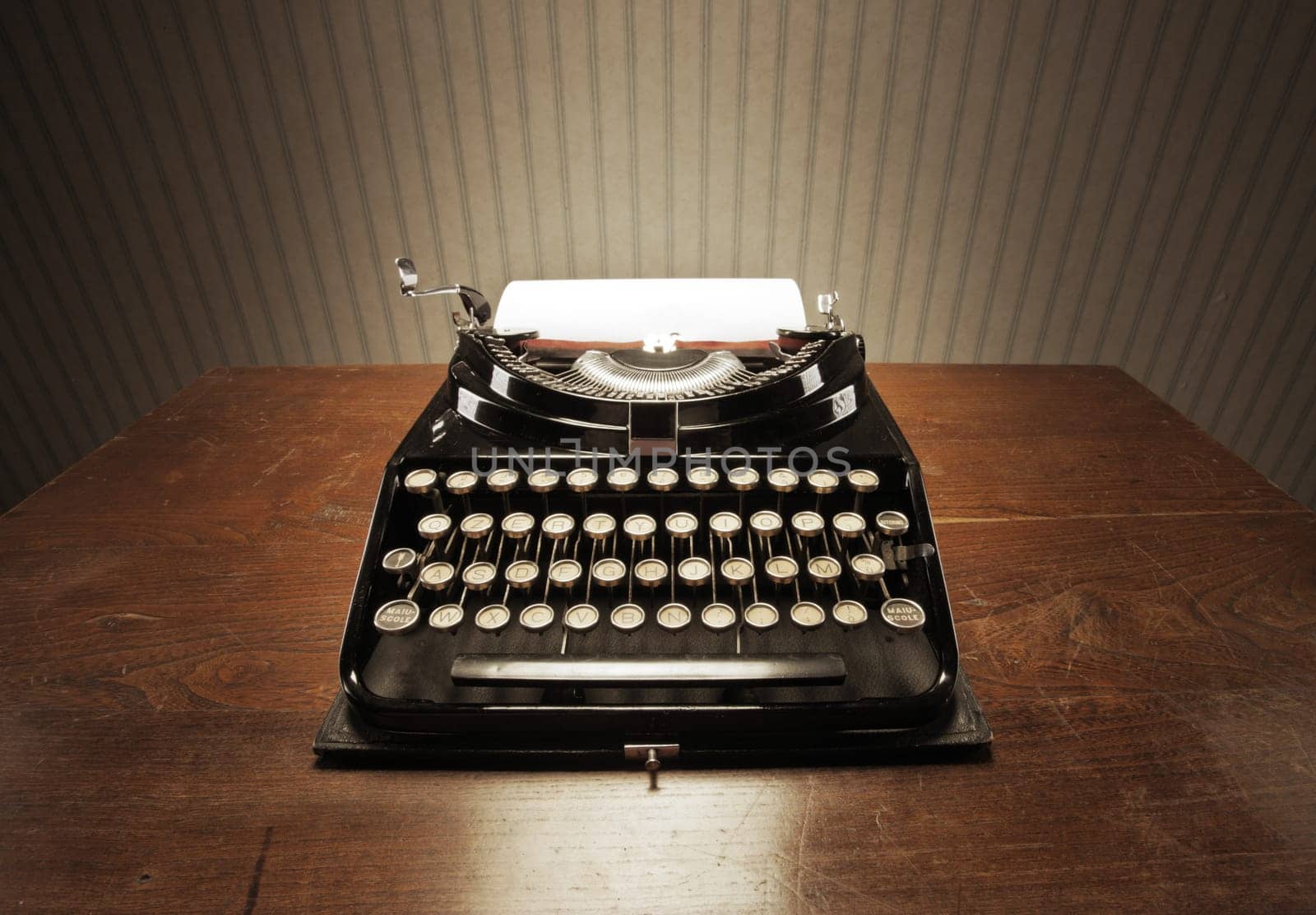 Old typewriter on a wooden desk