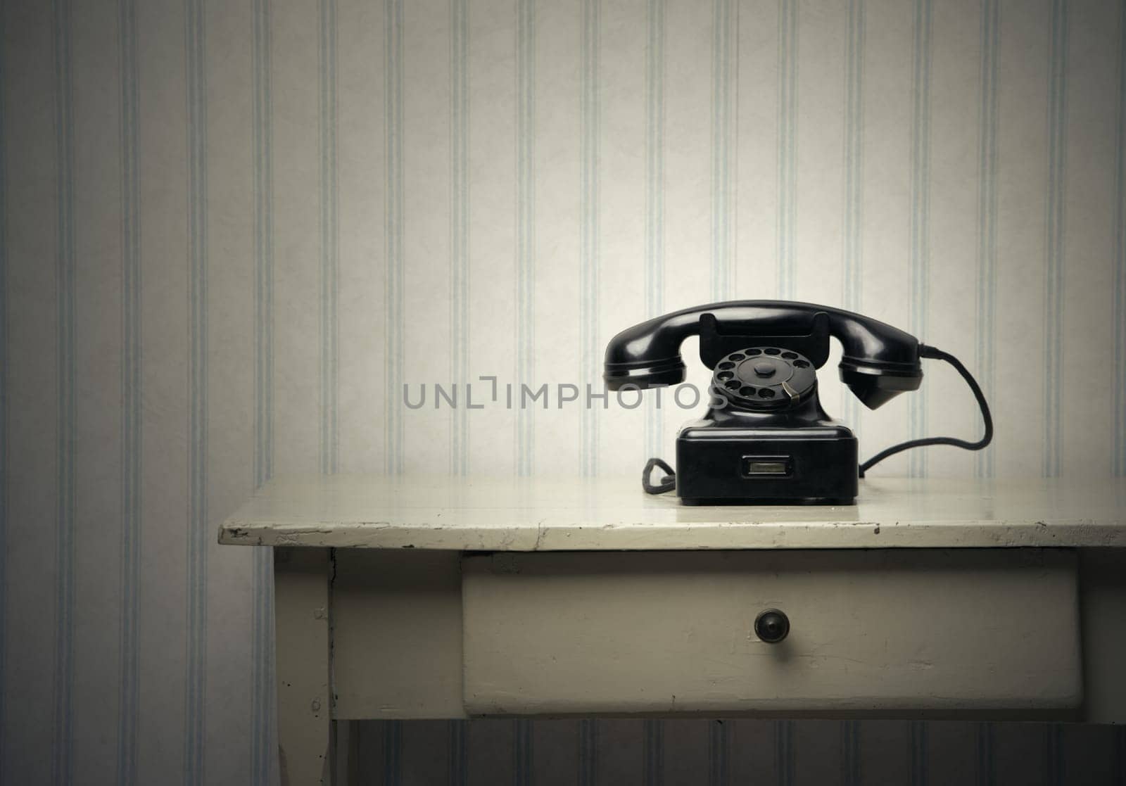 Old-fashioned phone on a wooden table