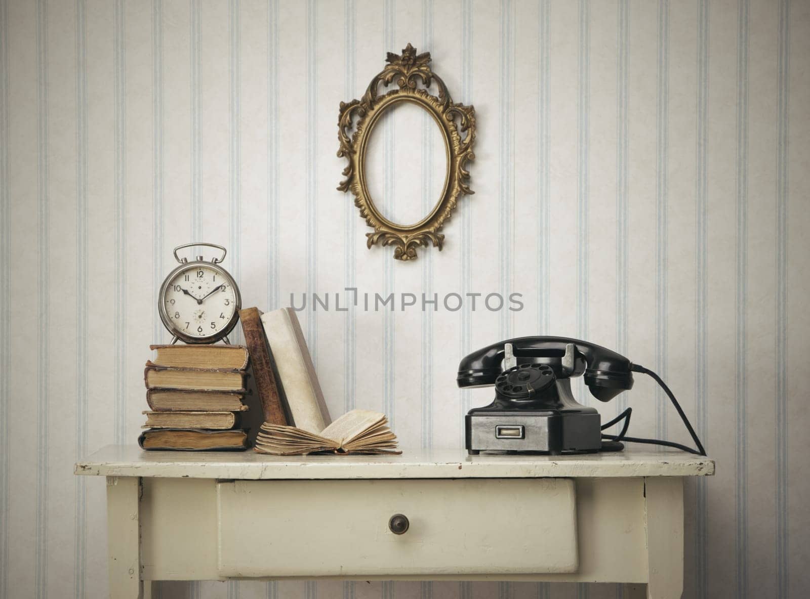 Vintage interior close up with table, books and old phone