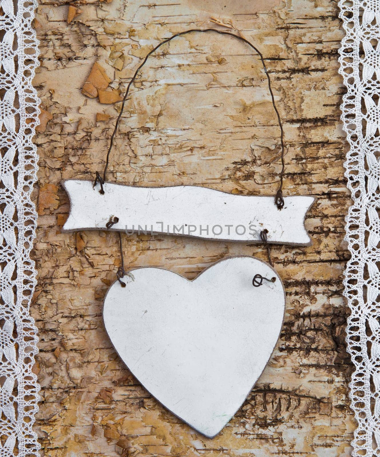 Heart with white tip on birch bark background