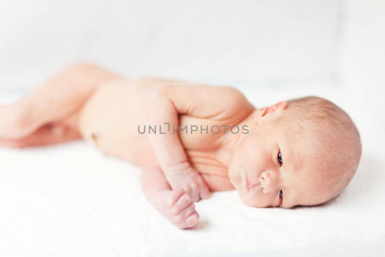 Cute beautiful newborn baby is laying down