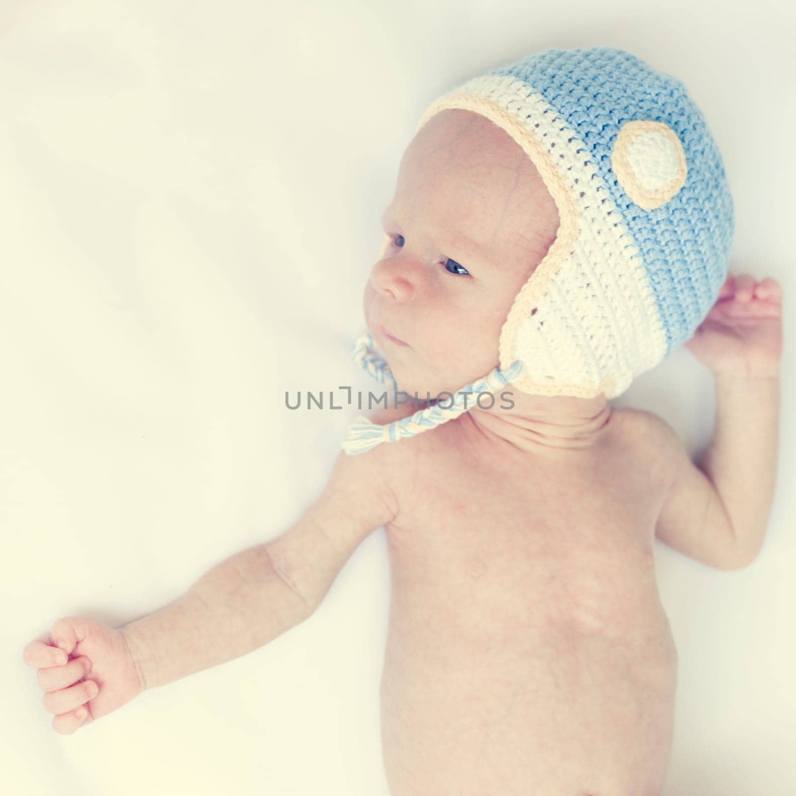 Cute beautiful baby is wearing a funny hat