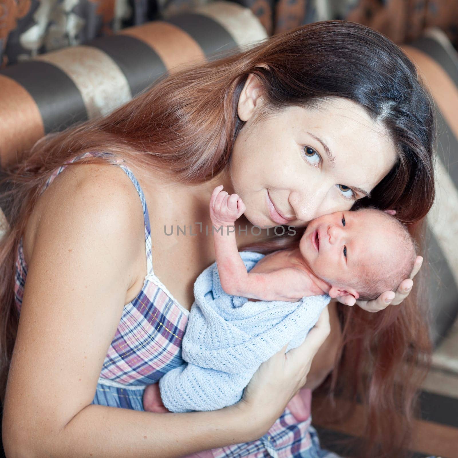 Mother is holding newborn baby