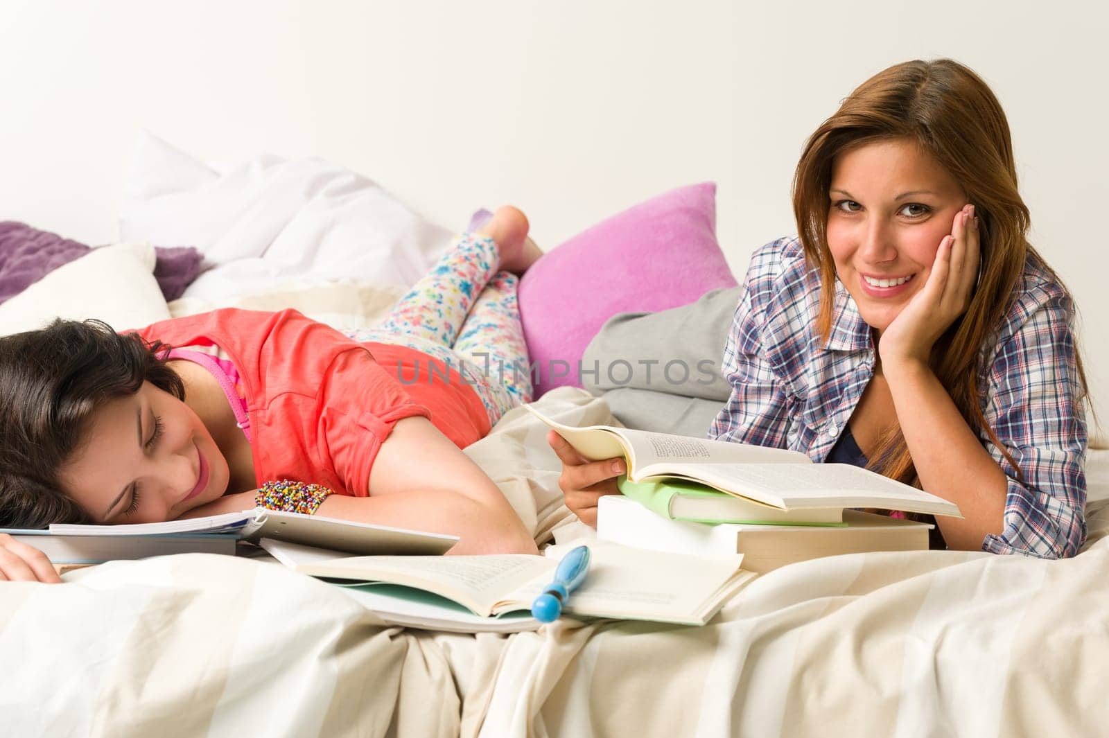 Young caucasian girls studying at home