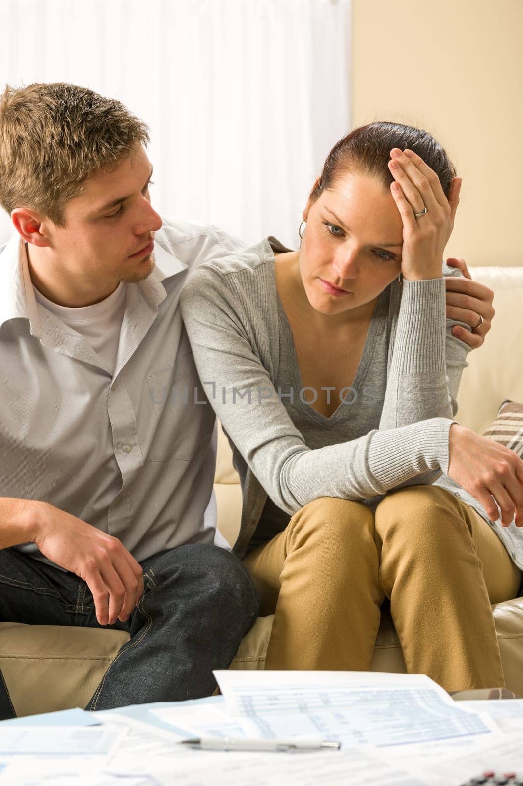 Young worried couple has problems with their budget