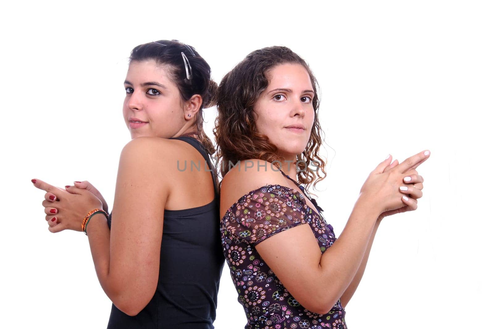 two girl ready to shoot with virtual gun isolated over white